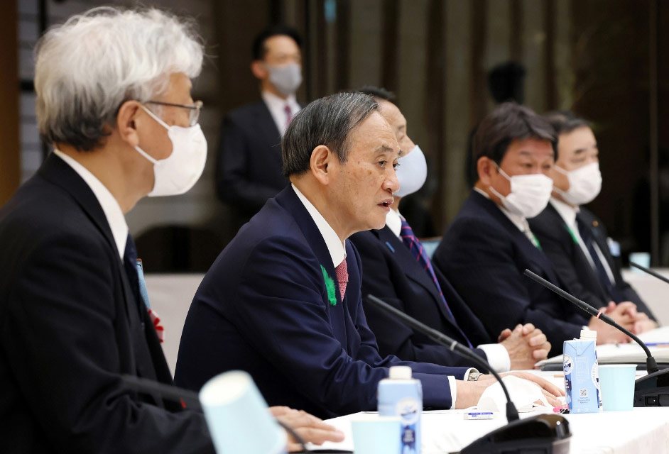 写真）第２回気候変動対策推進のための有識者会議で発言する菅総理大臣。2021年4月19日